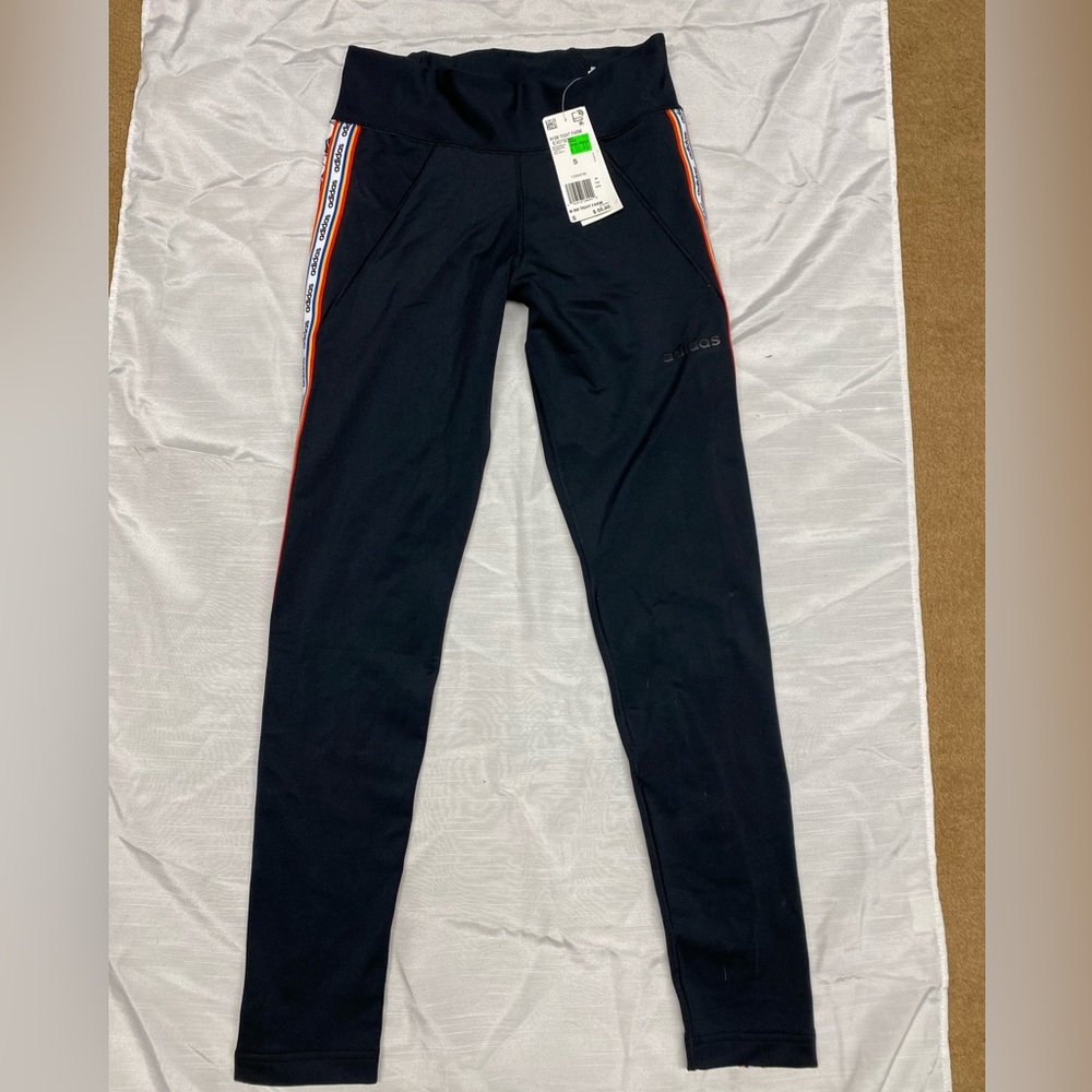 Adida’s black leggings with pattern on seam